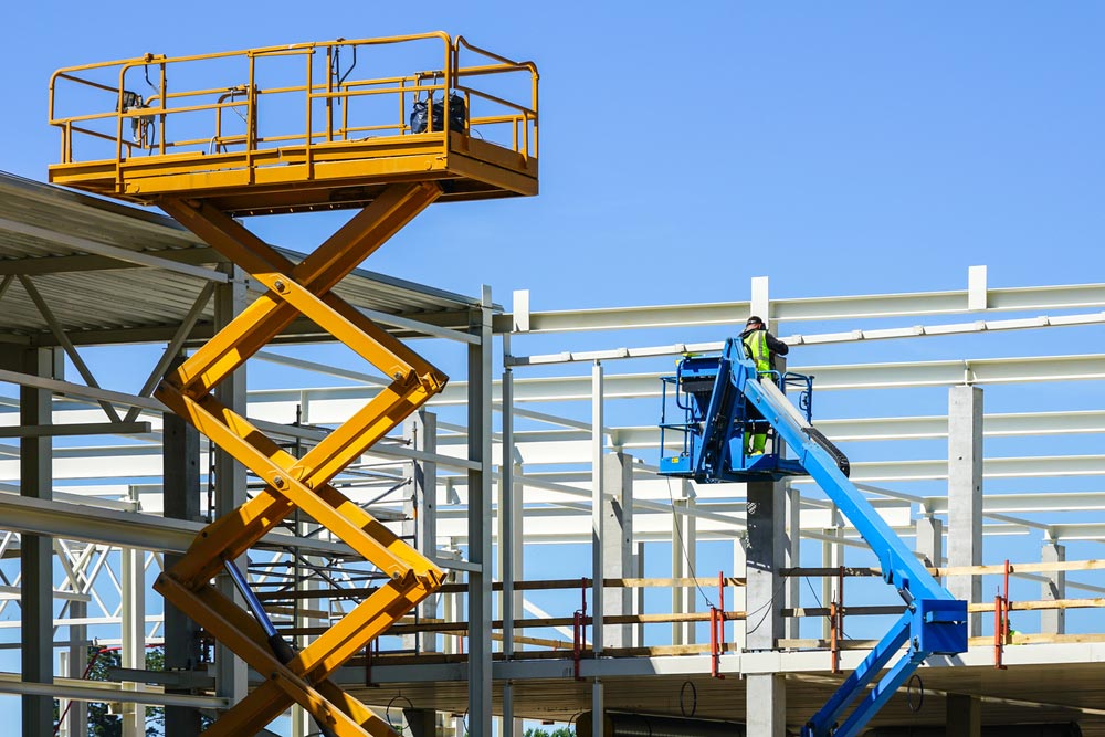 Yellow Electric Scissor Lift And Blue Boom Lift