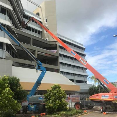 Hire cranes working on a commercial building in Cairns